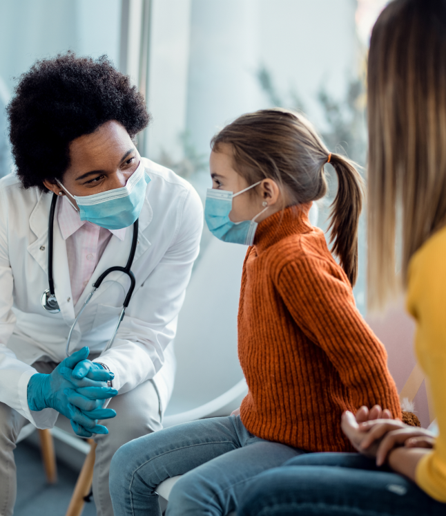 Paediatrician with a child in a clinic – understanding racial equity in healthcare